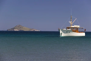 Images Dated 17th May 2006: GREECE, Dodecanese Islands, PATMOS, Agriolivadi Bay: Small Boat on Agriolivadi Bay