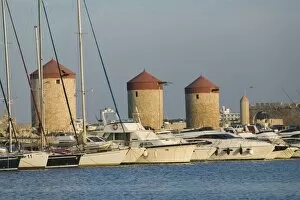 Images Dated 18th May 2006: GREECE, Dodecanese Islands, RHODES, Rhodes Town: Mandraki Harbor, Old Windmills