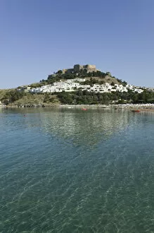 Images Dated 20th May 2006: GREECE-Dodecanese Islands-RHODES-Lindos: Lindos Harbor- Beach View with Acropolis