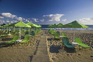 Greece and Greek Island of Crete with the city of Rethimnon with green umbrellas Greece and Greek Island of Crete with the city of Rethimnon with green umbrellas
