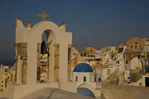 Greece and Greek Island of Santorini town of Oia with bell tower over looking