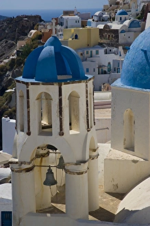 Greece and Greek Island of Santorini town of Oia with Blue Domed Churches with white Greece and Greek Island of Santorini town of Oia with Blue Domed Churches with white