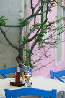 Images Dated 6th May 2006: GREECE-Ionian Islands-KEFALONIA-Fiskardo: Yacht Harbor-Cafe Table