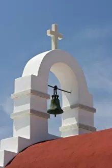 Greece, Mykonos, Hora. White bell tower and red roof of Greek Orthodox church
