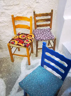 Images Dated 12th September 2018: Greece, Nissyros. Three chairs on patio
