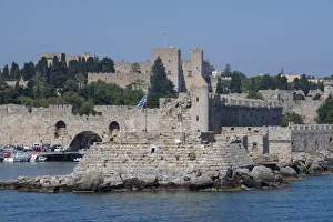 Greek Prints: Greece, Rhodes. Aegean Sea harbor view of the walled medieval Old Town. UNESCO