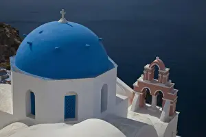 Images Dated 20th May 2009: Greece, Santorini. Bell tower and blue domes of church in village of Oia