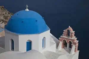 Images Dated 18th May 2009: Greece, Santorini. Bell tower and blue domes of church in village of Oia