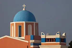 Images Dated 20th May 2009: Greece, Santorini. Bell tower and blue domes of church in village of Oia