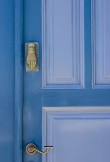 Greece, Santorini. Blue door with knocker in the shape of a hand