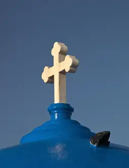 Firostefani Prints: Greece, Santorini. Church with blue dome and white cross in village of Firostefani
