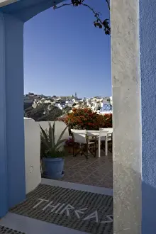 Greece, Santorini. Doorway to balcony tables at Thireas Restaurant