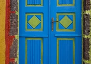 Greece, Santorini, Thira, Oia. Blue and lime green door colors