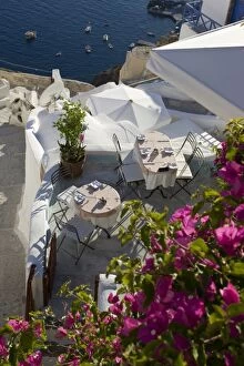 Images Dated 6th June 2005: Greece, Santorini, Thira, Oia. Looking down on patio tables set for dinner