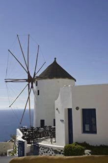 Greece, Santorini, Thira, Oia. Windmill overlooking the sea