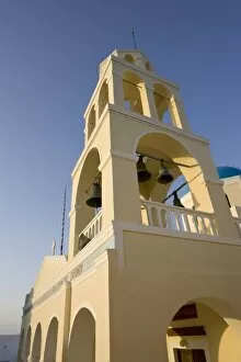 Images Dated 7th June 2005: Greece, Santorini, Thira, Oia. Yellow facade and bell tower of Greek Orthodox church
