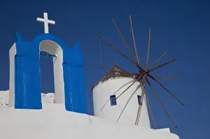 Wind Mill Prints: Greece, Santorini. Town of Oia and small bell tower with windmill