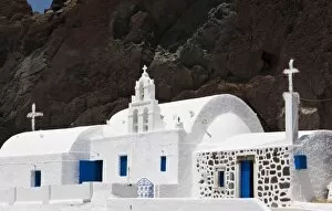 Images Dated 4th June 2005: Greece, Santorini. White Greek Orthodox church starkly contrasts with red cliff