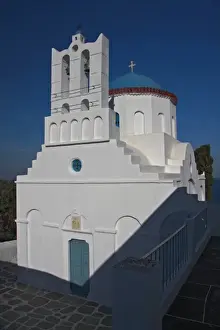 Walk Way Prints: Greece, Sifnos. A traditional Greek Orthodox church reflects the afternoon autumn sun