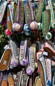 Souvenir Prints: Greek souvenir shoes on rack in downtown shopping area of Plaka, Athens, Greece