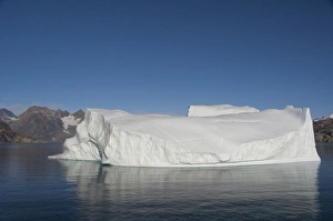 Images Dated 11th September 2010: Greenland, Southeast coast, Skjoldungen Fjord. Large iceberg in scenic fjord surrounded