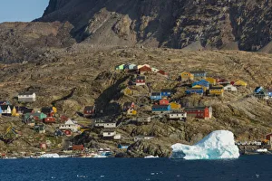 Greenland, Uummannaq. Colorful houses dot the rocky landscape