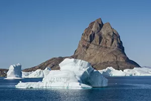 Greenland. Uummannaq. Uummannaq mountain and iceberg