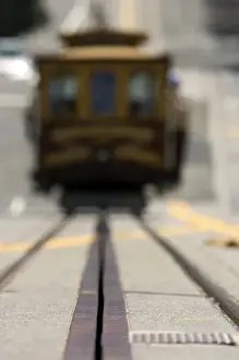Pavement Prints: Ground level view of an approaching San Francisco cable car