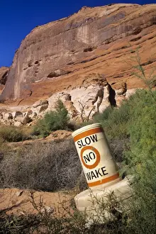 Reservoir Prints: Grounded buoy in Forgotten Canyon at location once 80 feet below the surface of Lake Powell