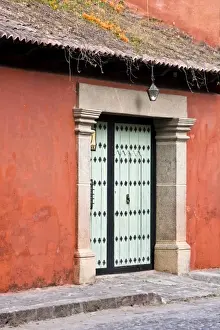 Sacatepequez Department Prints: Guatemala, Antigua. A colonial house with ornate door in the town of Antigua