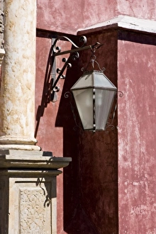 Sacatepequez Department Prints: Guatemala, Antigua. Ornate lantern on colorful wall