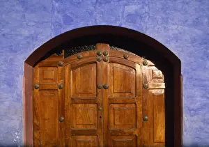 Door Way Prints: Guatemala, Antigua, Detail of wooden doorway and brightly painted walls of colonial