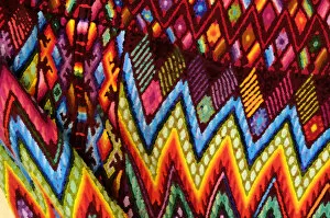 Guatemala, Chichicastenango, Painterly effect close-up of colorful fabric. Credit as