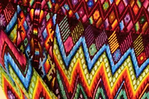 Style Prints: Guatemala, Chichicastenango, Painterly effect close-up of colorful fabric. Credit as
