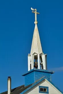 Gull sits atop a church steeple in Dene tribe village of Lutsel K e on The Great Slave Lake