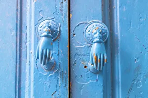 Tunisia Prints: Hammamet, Nabeul, Tunisia. Hand shaped door knockers on a blue painted door