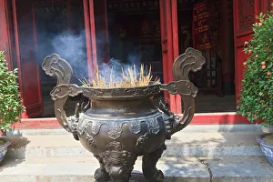 Vietnam Prints: Hanoi, Vietnam. Incense offering at Ngoc Son Pagoda (Temple of the Jade Mound), a
