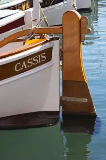 Moore Prints: In the harbour in Cassis village. A traditional style boat with wooden rudder marked