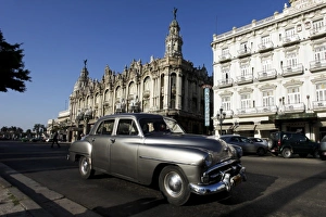 Images Dated 27th November 2010: Havana, Cuba, UNESCO World Heritage City. Vintage American car drives down Prado Boulevard
