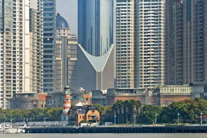 Modern Prints: High-rise and light house by Huangpu River in Pudong, Shanghai, China