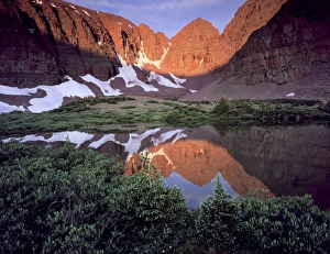 High Uintas Wilderness, Utah. USA. Morning light on quartzite cliffs of Red Castle