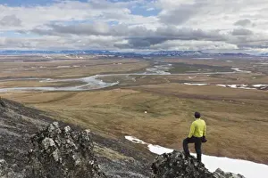 Meander Prints: A hiker looks over the confluence of the Nigu and Etivlik Rivers near the base of