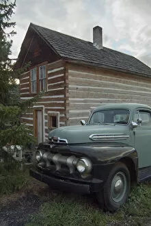 Historic log cabin and antique Ford pick up on the property of Summerhill Pyramid Winery