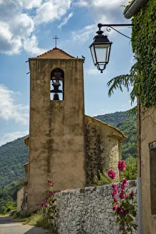 Architecture Prints: Hollyhocks flowers blooming in Provence region of Southern France