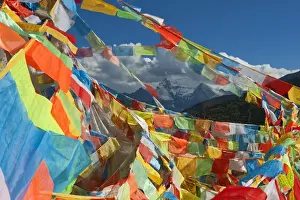 Sichuan Prints: One of Three Holy Peaks of Yading Nature Reserve surrounded by Prayer Flags, Sichuan