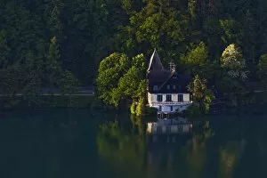 Home on shoreline of Lake Bled at sunrise, Bled, Slovenia