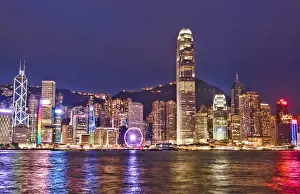 Skyline Prints: Hong Kong China skyline harbour night with new Ferris Wheel in city skyscrapers