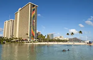 Honolulu, Hawaii. Lake and skyline of Rainbow Tower of Hiltons Waikiki Village