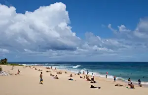 Images Dated 2027: Honolulu, Hawaii. People on white sand of Sandys Beach Park in Oahu