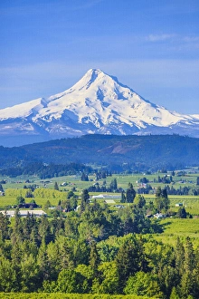 Images Dated 26th April 2016: Hood River, Oregon. Snow covered Mount Hood, foothills, valley, farmland with orchards